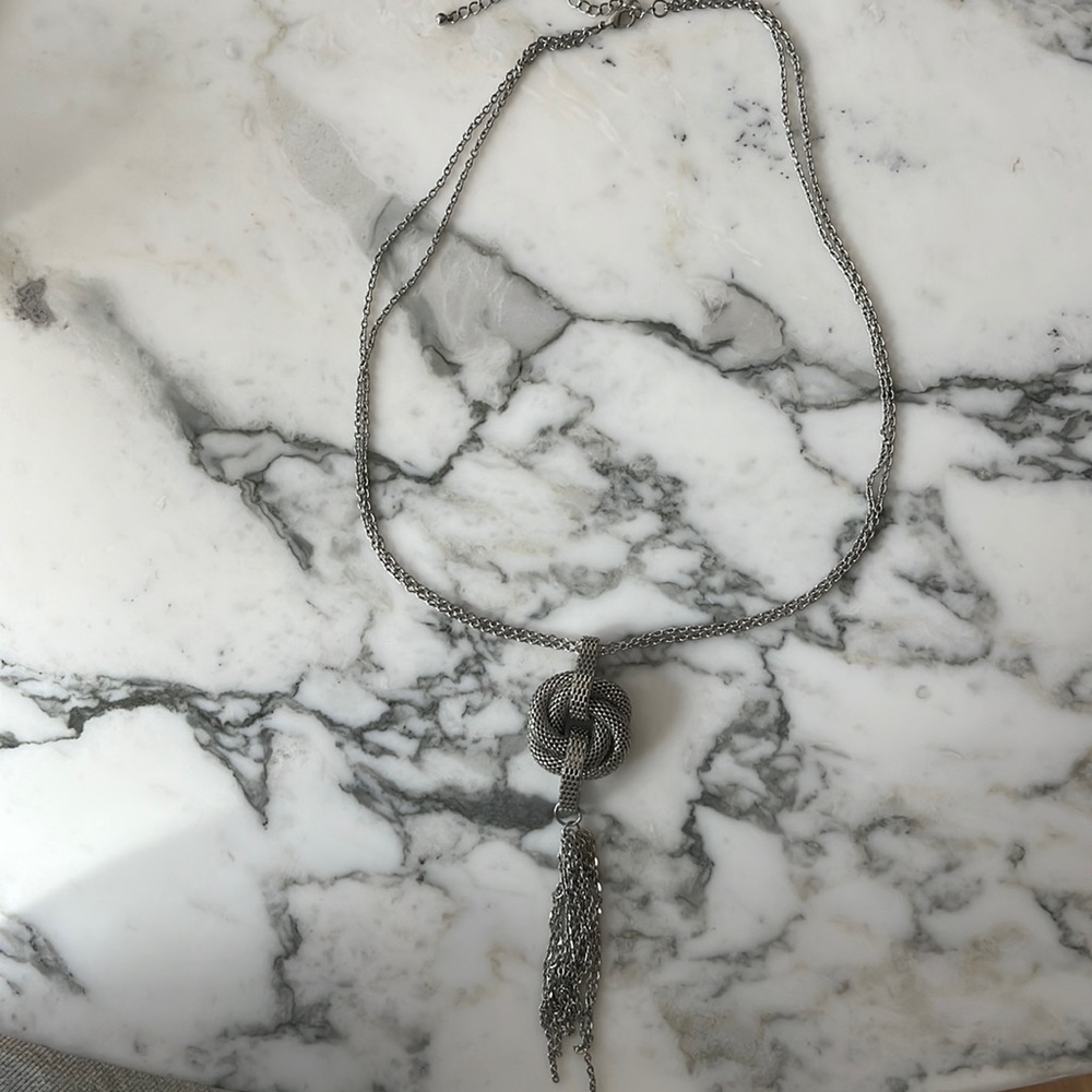 Necklace, costume jewelry metal pendant with tassel.  Fun sexy piece.